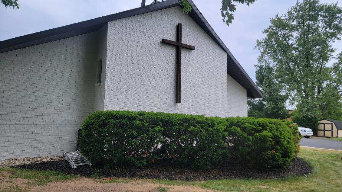 Church painting exterior painting — front elevation with cross and landscaping (Speese Painting)