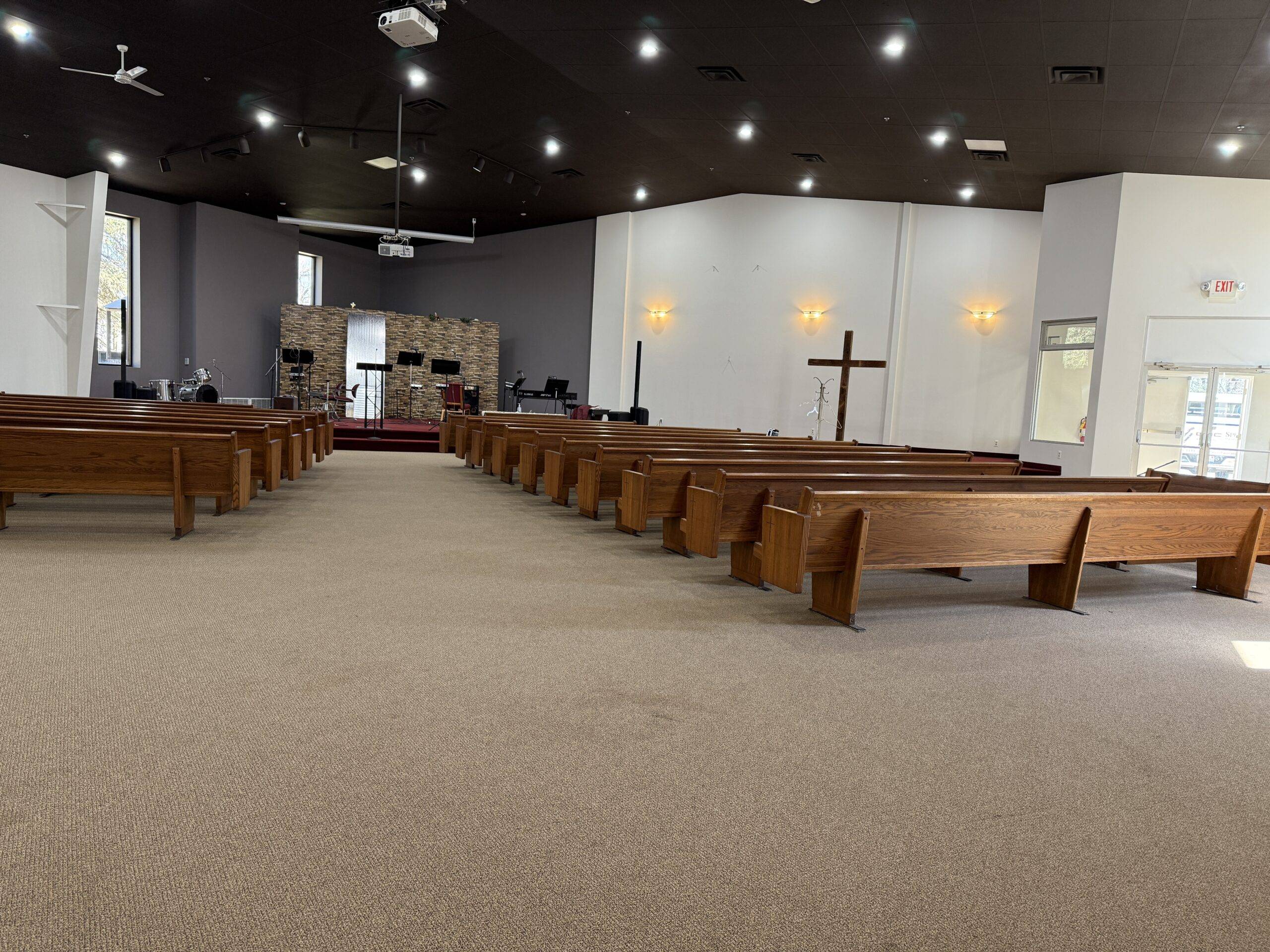 Church Painting sanctuary interior painting — dark ceiling, white walls, pews (Speese Painting)