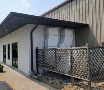 Church painting exterior HVAC enclosure and painted block — service area painting (Speese Painting)