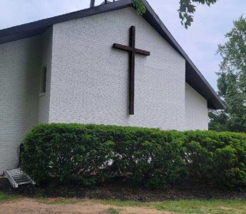 Church painting exterior painting — front elevation with cross and landscaping (Speese Painting)